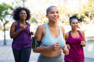 Happy group of overweight friends exercising together and taking GLP-1 for weight loss
