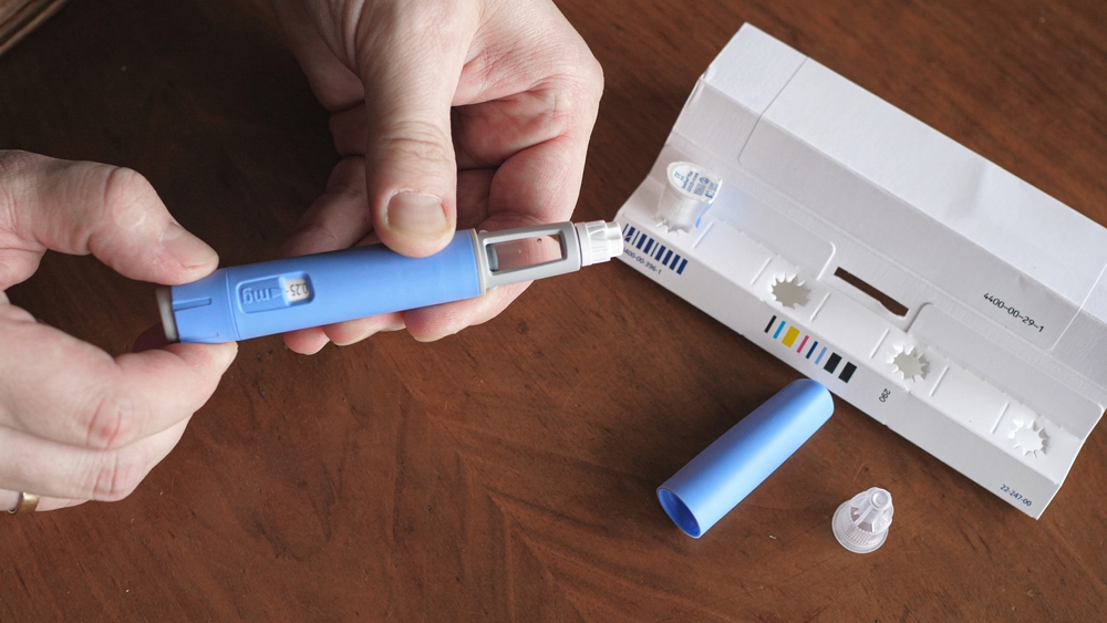A patient preparing a compounded GLP-1 injection with vitamin B6