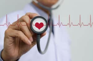 A stethoscope with a graphic of an EKG