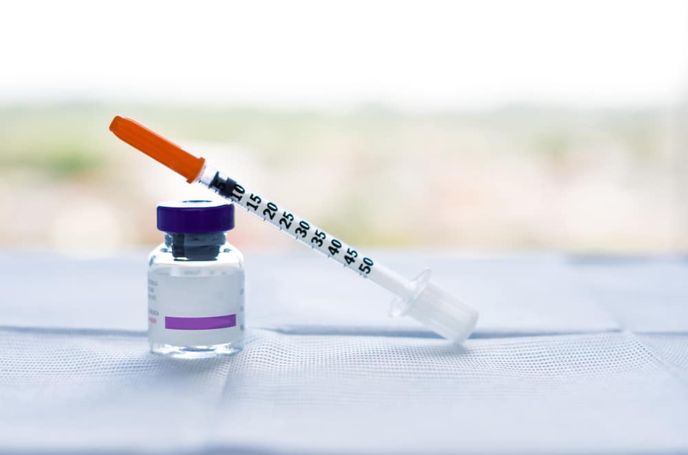 Vial and syringe representing compounded GLP-1 medication preparation.